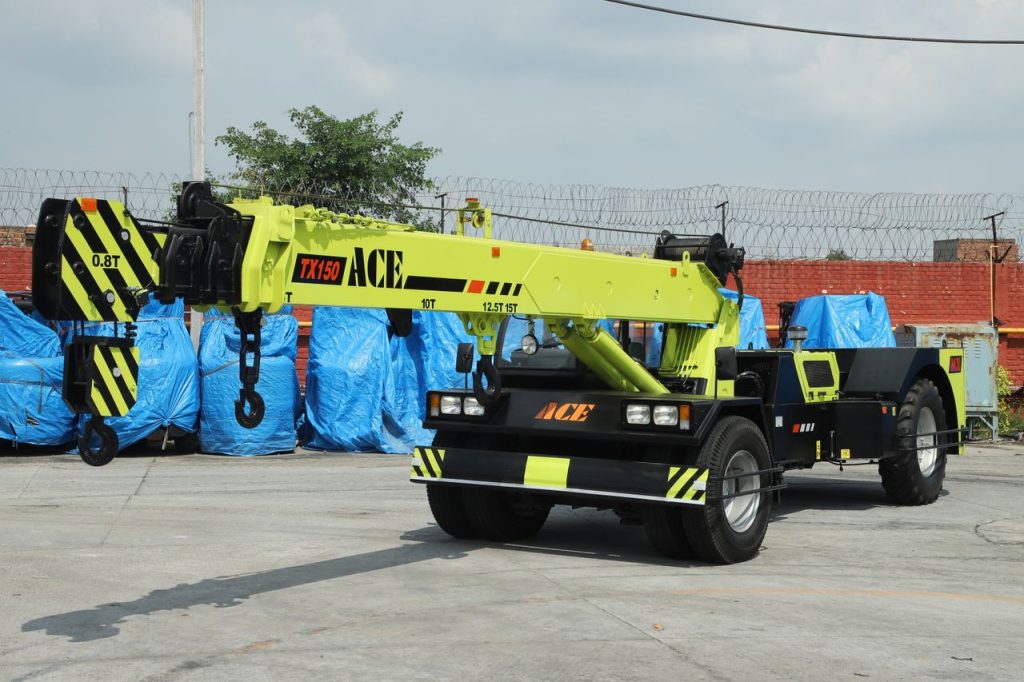 ACE TX 150 crane stands ready in an industrial yard in Faridabad, India.